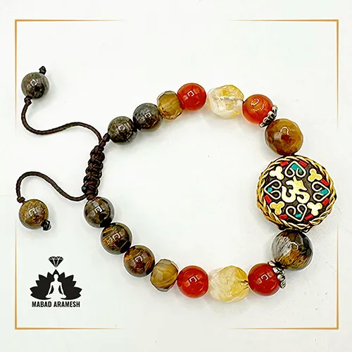 دستبند زنانه ترکیبی با خرجکار نقره و مدال تبتی دستبند زنانه ترکیبی با خرجکار نقره و مدال تبتی